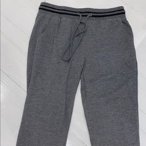 Grey joggers with black stripe on waist and ankle